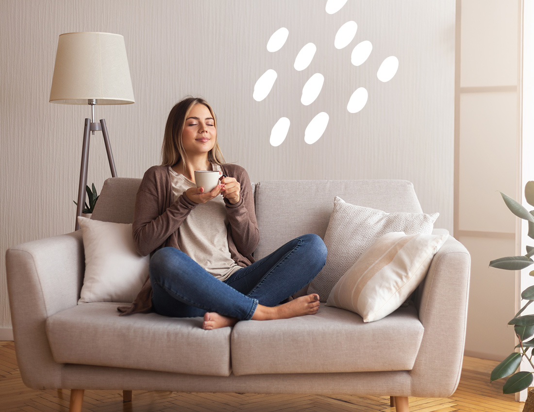 Woman enjoying her comfortable, sustainable home